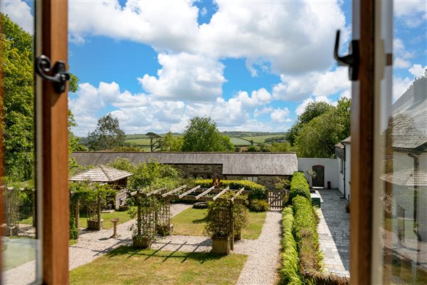 View of courtyard garden and countryside views beyond.